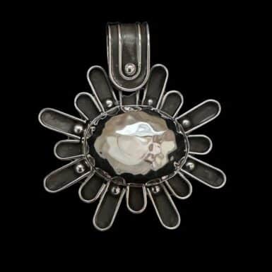 Handmade sterling silver hammered rays pendant
