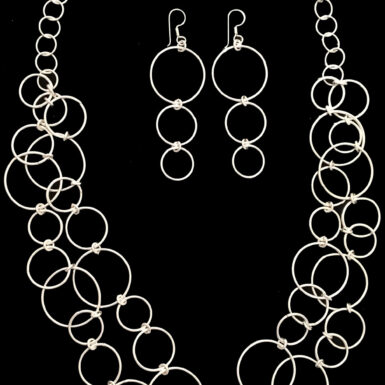 Handmade, sterling silver circle shaped necklace and earring set
