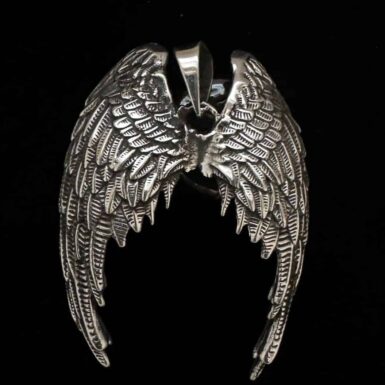 Handcrafted in Taxco Mexico sterling silver pendant with victory wings